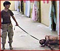 Abu Ghraib - torturer with leash